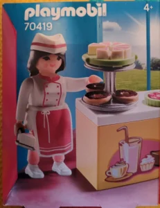 Pastry chef with cakes