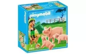 Boy Feeding Pigs